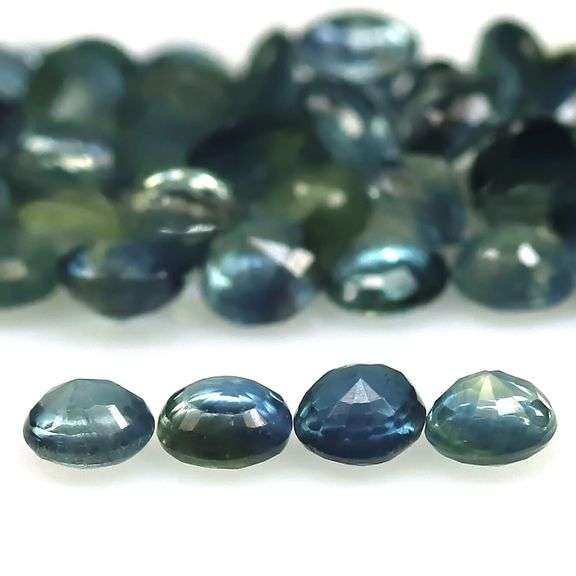 Stunning blue green 5.91ct round cut Sapphire set