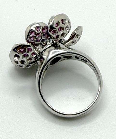 Hand made Italian 18kt white gold diamond and natural ruby articulated flower ring