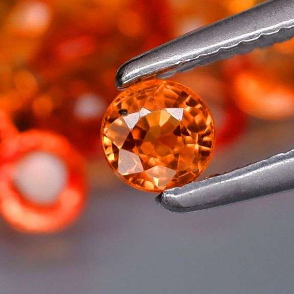 High grade 4.50ct round cut Songean Sapphire set