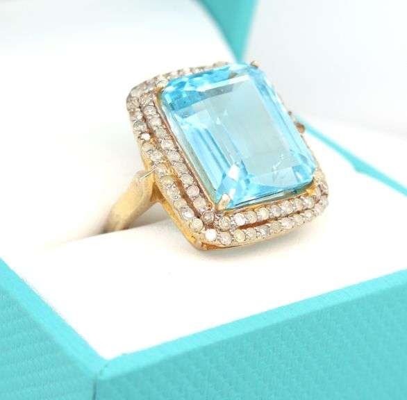 Bewitching Large 9.13CTS Emerald Cut Blue Topaz & Diamond ring in 14K Yellow Gold Over Sterling Silv