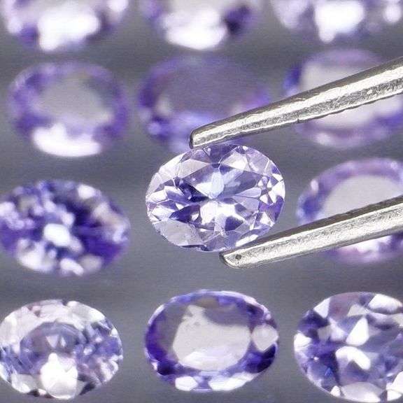 Heavy flashing 2.88ct oval cut Tanzanite set
