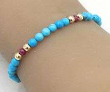 Turquoise, ruby and gold bead bracelet