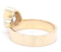 14kt Yellow gold oval and round Moissanite bezel set wide ring