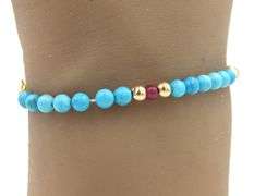 Turquoise, ruby and gold bead bracelet