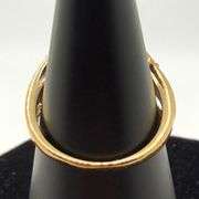 10kt Yellow Gold Baguette and Round Brilliant Cut Diamond Bypass Ring