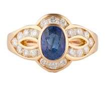 0.65ct Oval Sapphire and 0.25ctw Diamond Frame Ring in 18K