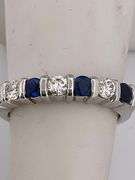 CERTIFIED PLATINUM DIAMOND AND SAPPHIRE BAND
