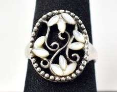 Cut Out Floral Design Ring with White Stones in Sterling Silver 4.1grams Size 7.5