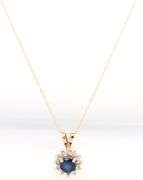14kt Yellow gold round sapphire and diamond halo pendant on chain
