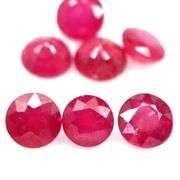 Vibrant 8.12ct round cut imperial red Ruby set