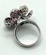 Hand made Italian 18kt white gold diamond and natural ruby articulated flower ring