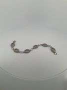CERTIFIED BRAND NEW 14K WHITE GOLD AND DIAMOND LINK BRACELET.