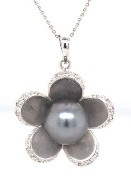 14kt White gold 10x10.5 Tahitian pearl and diamond flower pendant on chain