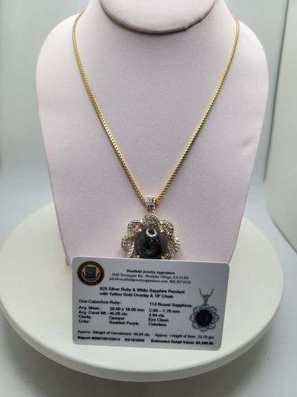 Very large 35.5ctw Cabochon ruby with Natural sapphire Halo – Oval Cut Elegance pendent