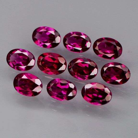 Amazing 9.80ct oval cut violet Garnet set