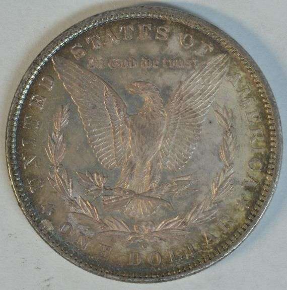 Gorgeous essentially Gem BU 1880-O Morgan Silver Dollar. Original rainbow toned
