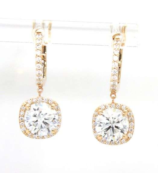 2.10ctw round brilliant cut Lab grown diamond in 0.16ctw huggie hoop