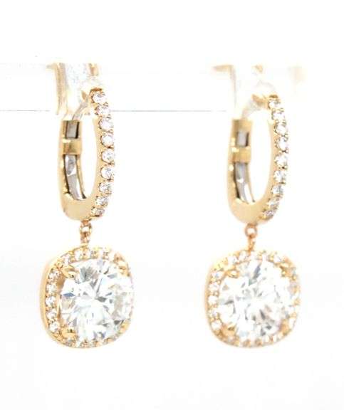 2.10ctw round brilliant cut Lab grown diamond in 0.16ctw huggie hoop