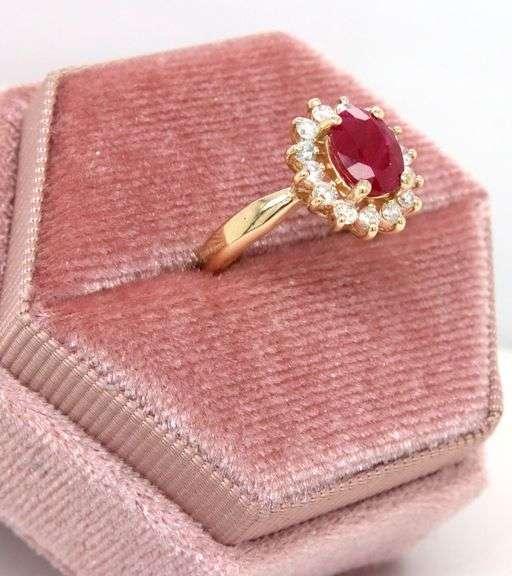 14kt Yellow gold oval lead treated ruby and diamond halo ring