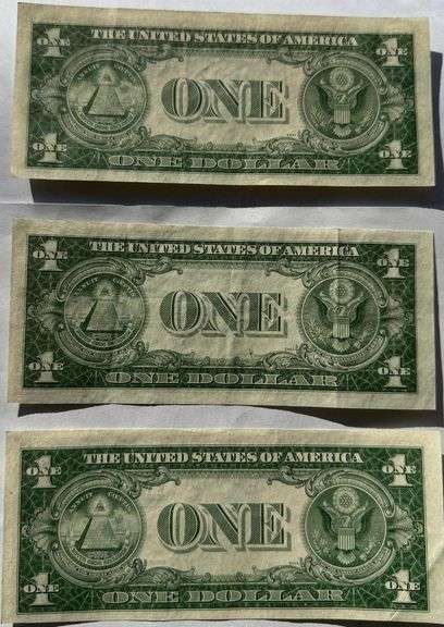 Three $1 1935D Near Unc Silver Certificates.