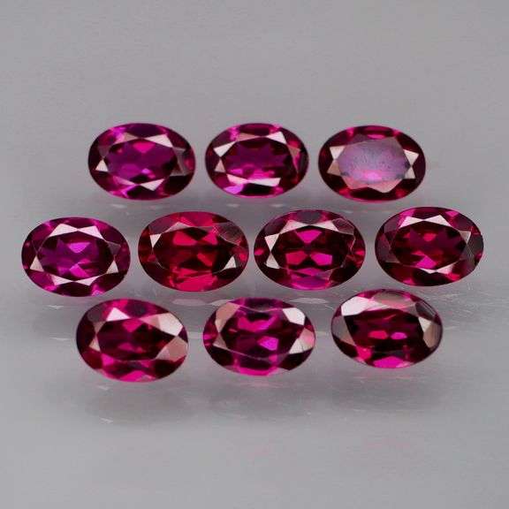 Amazing 9.80ct oval cut violet Garnet set