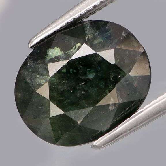 Shimmering 5.10ct greenish black Sapphire -Heated only!!!