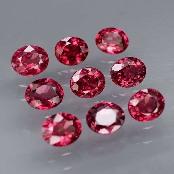 Lovely 6.08ct oval cut cherry red Rhodolite Garnet set