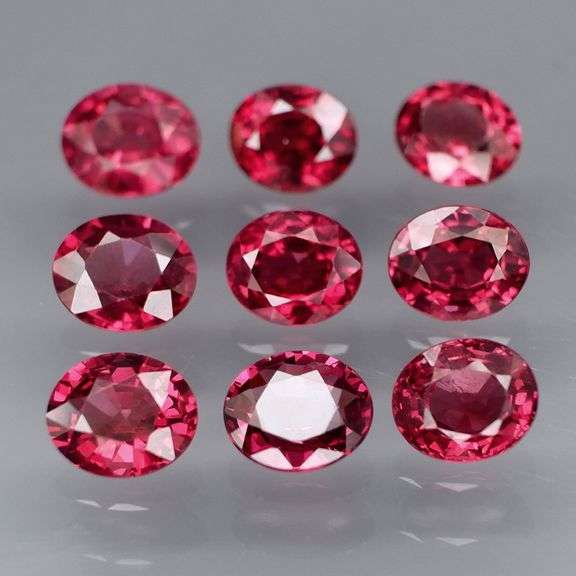Lovely 6.08ct oval cut cherry red Rhodolite Garnet set