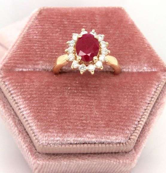 14kt Yellow gold oval lead treated ruby and diamond halo ring
