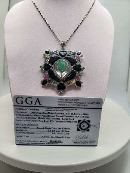 Very rare and collectable 26.14 ctw onyx, sapphire, ruby, emerald pendent