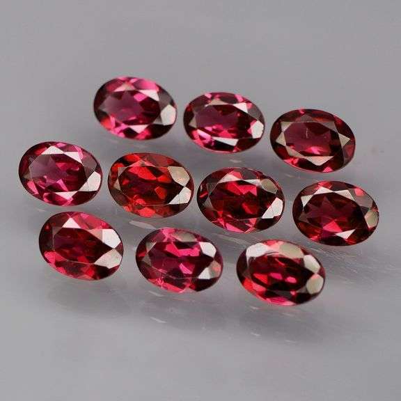 Lovely 9.09ct oval cut cherry red Rhodolite Garnet set