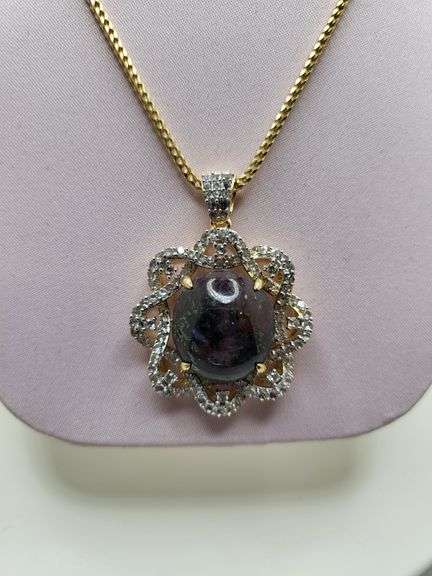 Very large 35.5ctw Cabochon ruby with Natural sapphire Halo – Oval Cut Elegance pendent