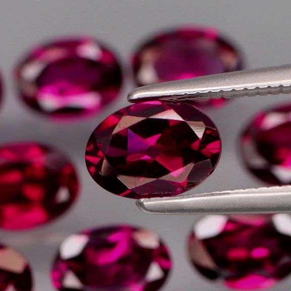 Amazing 9.80ct oval cut violet Garnet set