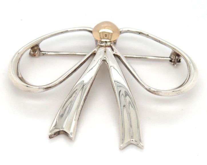 Sterling silver and 14kt Yellow gold accent bow brooch