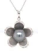 14kt White gold 10x10.5 Tahitian pearl and diamond flower pendant on chain