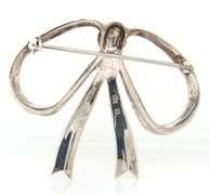 Sterling silver and 14kt Yellow gold accent bow brooch