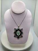 Very rare and collectable 26.14 ctw onyx, sapphire, ruby, emerald pendent