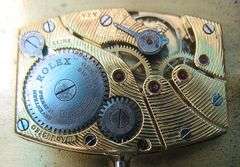 CONTENT OF SAFE DEPOSIT BOX: RARE ROLEX ART DECO MEN'S WATCH