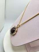 Very large 35.5ctw Cabochon ruby with Natural sapphire Halo – Oval Cut Elegance pendent