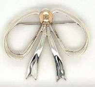 Sterling silver and 14kt Yellow gold accent bow brooch