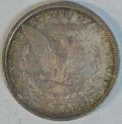 Gorgeous essentially Gem BU 1880-O Morgan Silver Dollar. Original rainbow toned