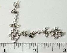 Feminine 14K White Gold Diamond Dangle Earrings