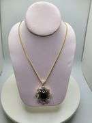 Very large 35.5ctw Cabochon ruby with Natural sapphire Halo – Oval Cut Elegance pendent