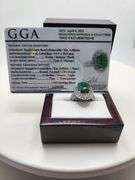 very nice dyed green beryl emerald ring. Over 6 ctw with round sapphire corundumset in silver