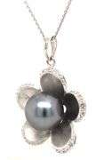 14kt White gold 10x10.5 Tahitian pearl and diamond flower pendant on chain