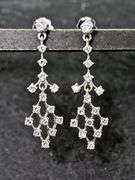 Feminine 14K White Gold Diamond Dangle Earrings