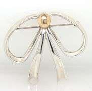 Sterling silver and 14kt Yellow gold accent bow brooch