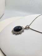 Very large 35.5ctw Star Blue Sapphire Cabochon with Natural Diamond Halo – Oval Cut Elegance pendent
