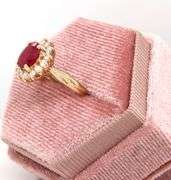 14kt Yellow gold oval lead treated ruby and diamond halo ring
