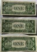 Three $1 1935D Near Unc Silver Certificates.